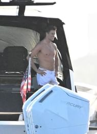 Tom Brady standing shirtless in his yacht (via Backgrid for Page Six)